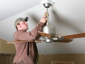 Man installing ceiling fan